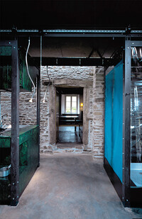 Shower and kitchen on a stone wall